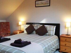 master-bedroom-with-views-of -the-Cairngorm-Mountain-and-ski-area